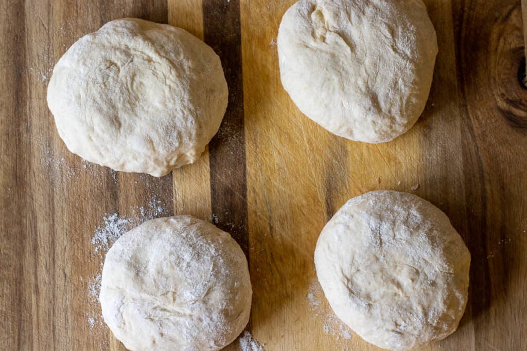 The dough is divided into 4 pieces.