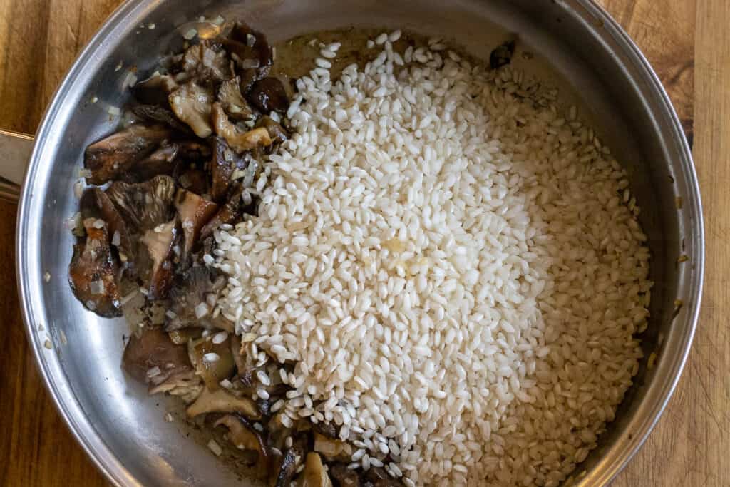 The rice added to the pan.