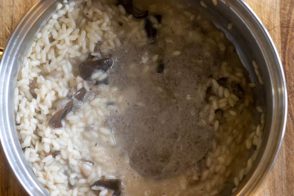 Mushroom purée added to the risotto.