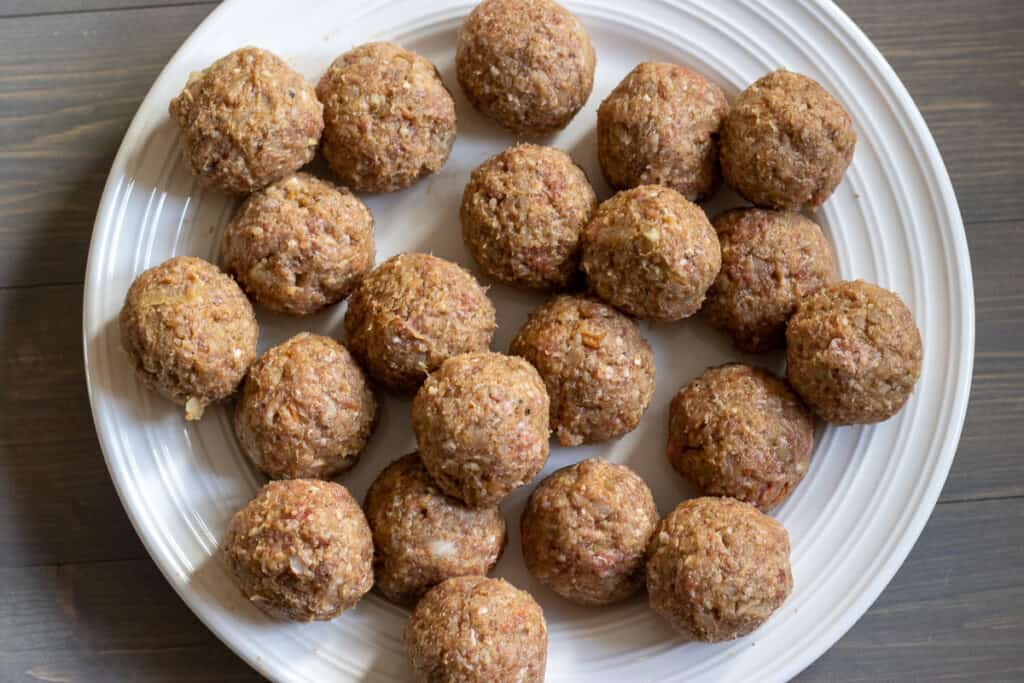 The kofte mixture shaped into small meatballs.