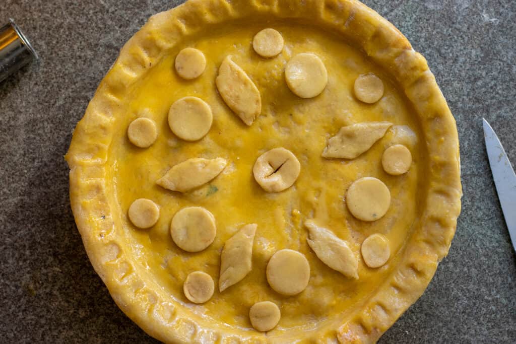 Steak pie is decorated, egg washed and ready to go in oven.