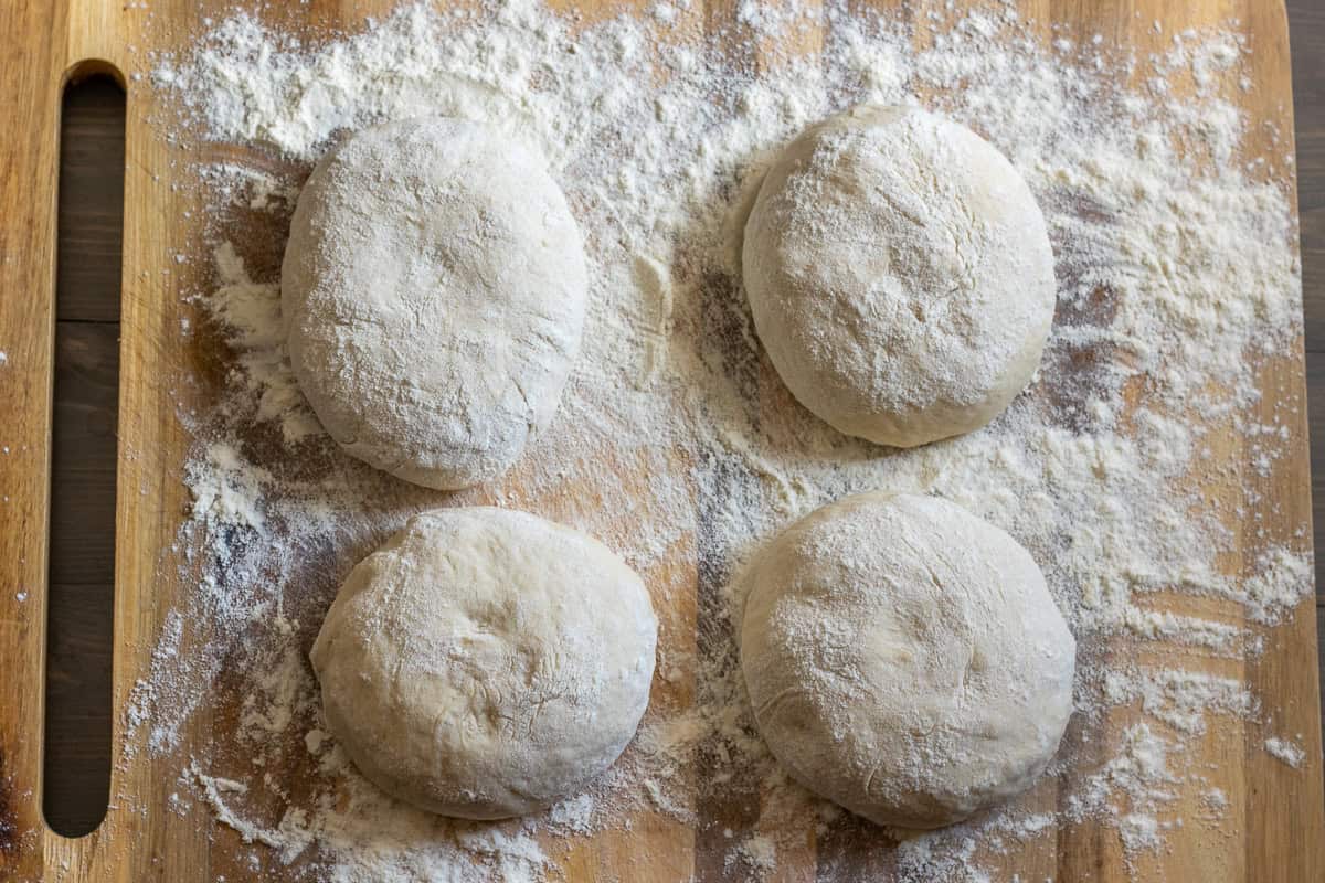The dough is divided into 4 equal pieces.