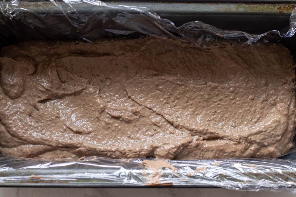The pate is transferred into a terrine mold.