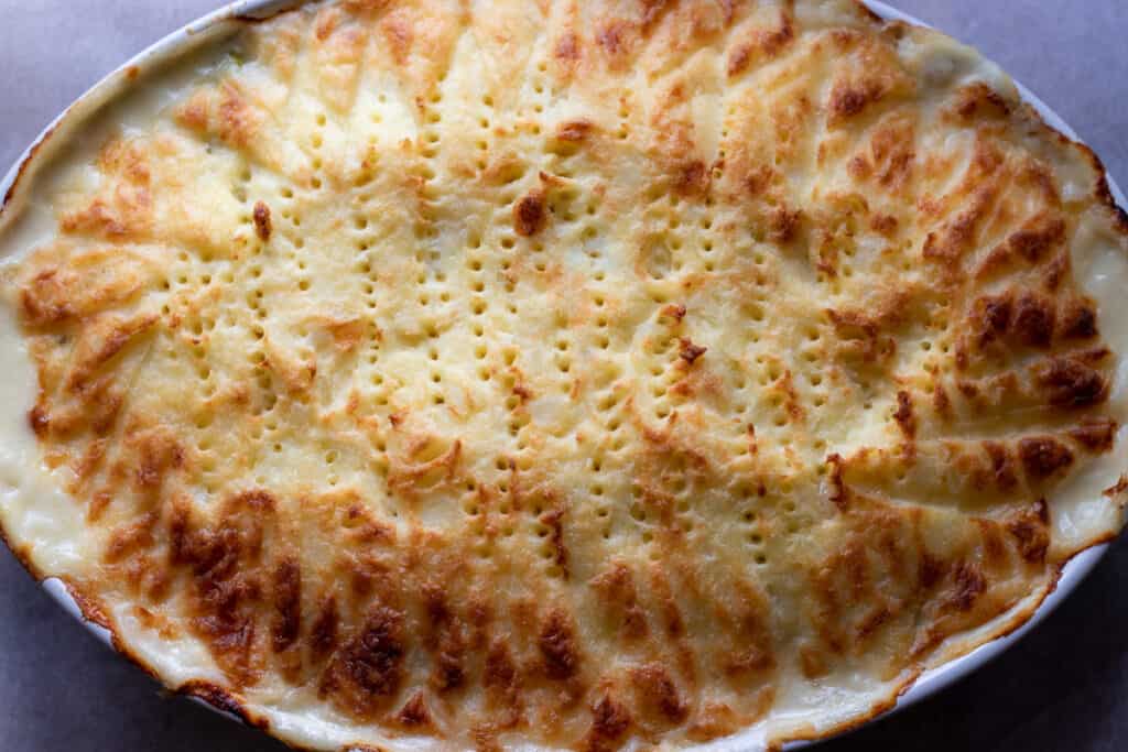 The pie freshly baked, with a golden top.