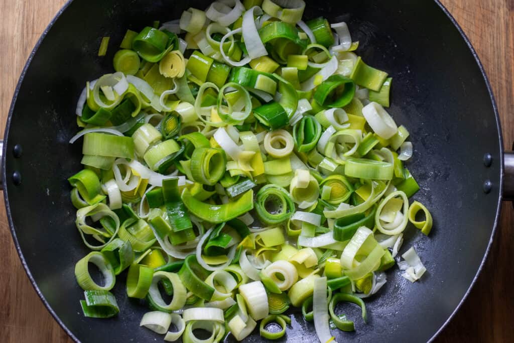 Sautéing the leek with butter.