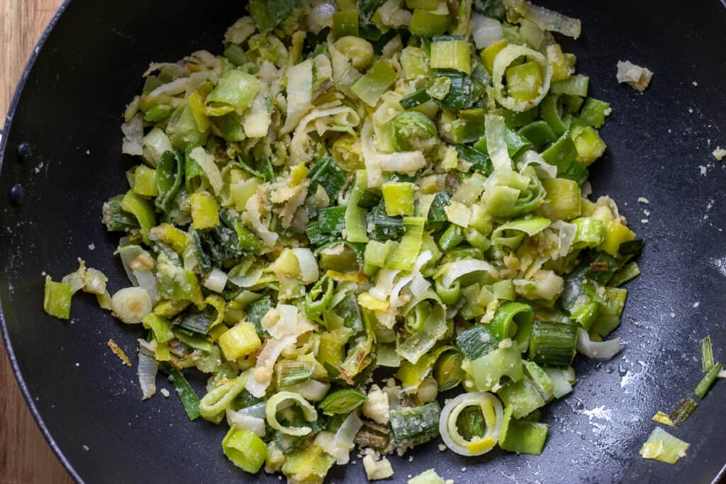 Sautéing the flour with the leeks.