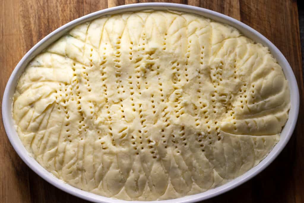 The filling covered with mashed potatoes.