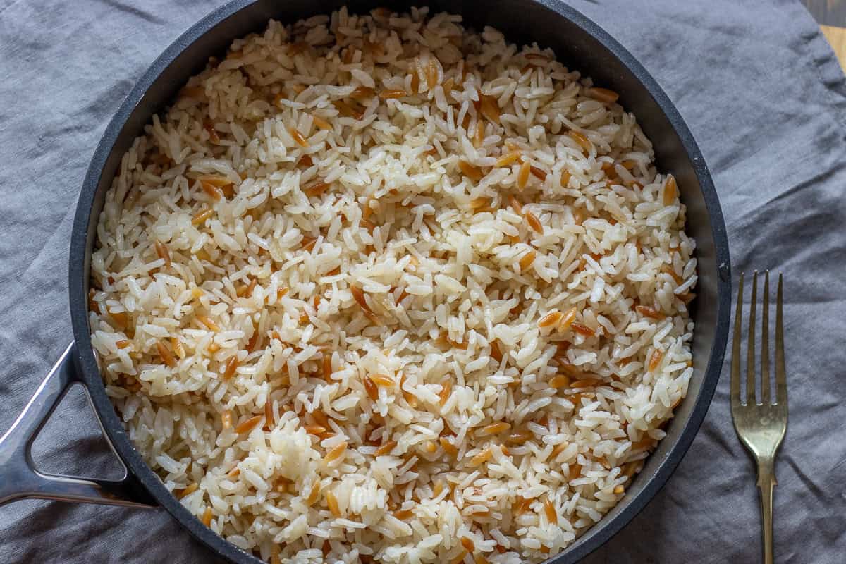 Rice fluffed with a fork.