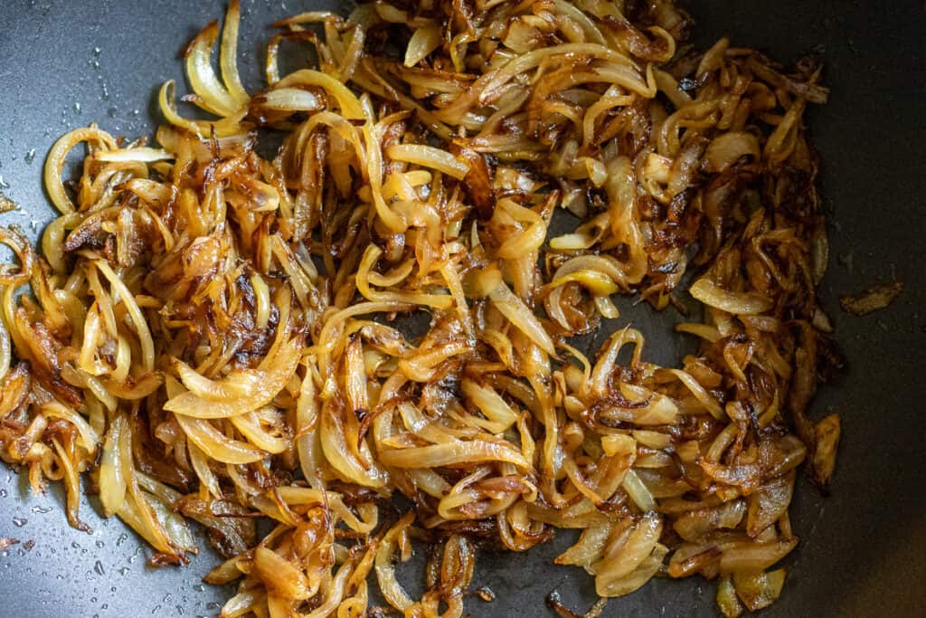 Sliced onions are sautéed until lightly caramelised.