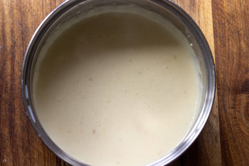 Creamy bechamel sauce in a pan.