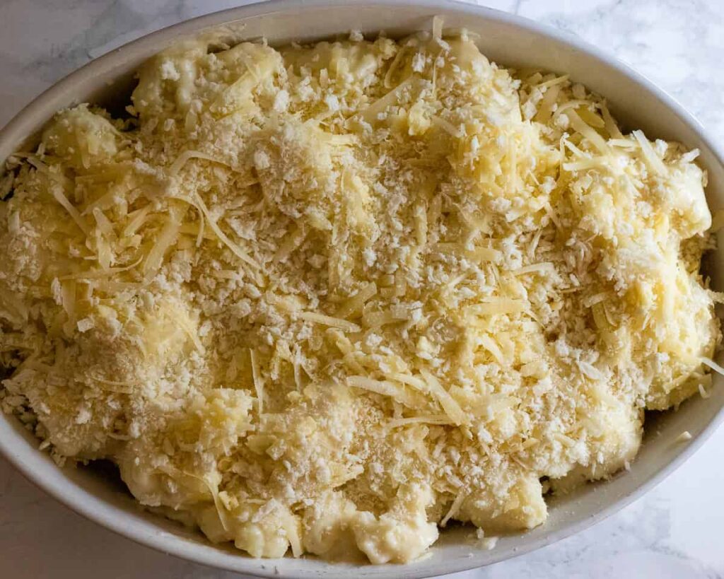 Cheese and breadcrumbs sprinkled on top of the cauliflower.