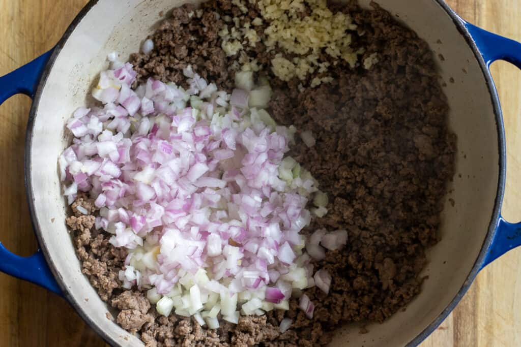 Sautéing the onions and garlic along with the beef.
