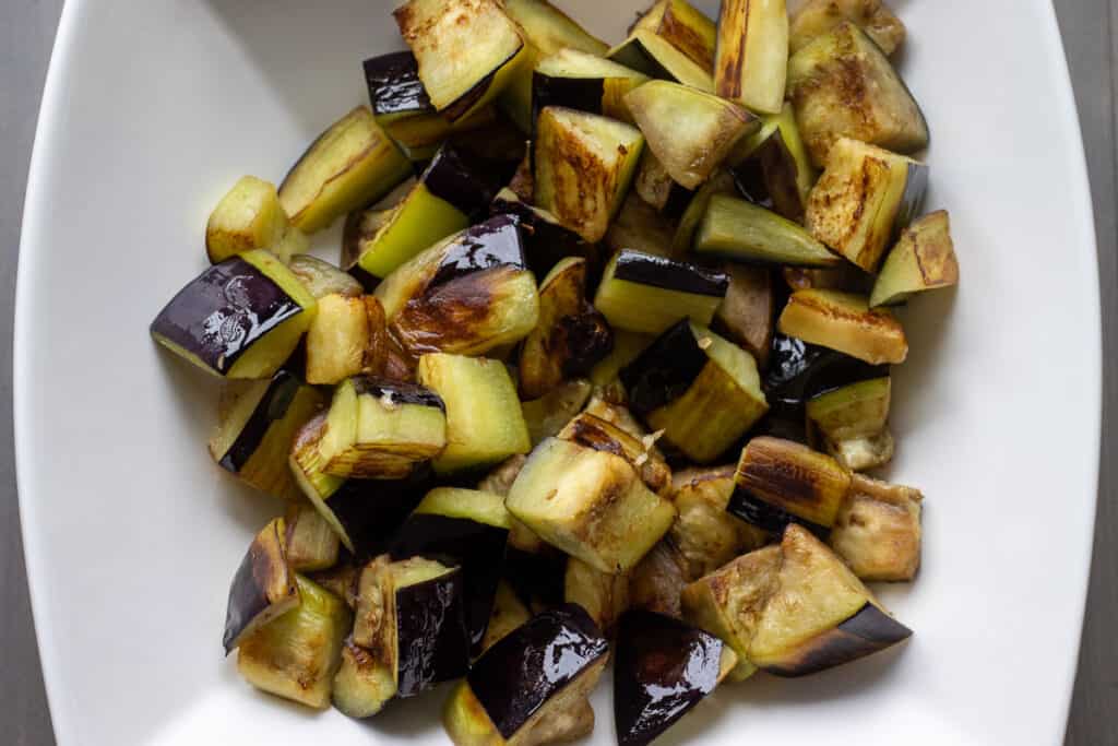 Eggplants are placed in a bowl.