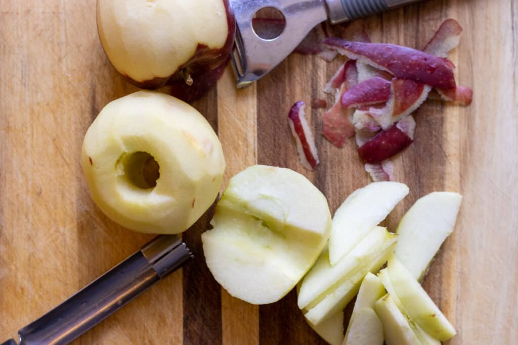 Peeled, cored, and sliced apples for apple crumb cake.
