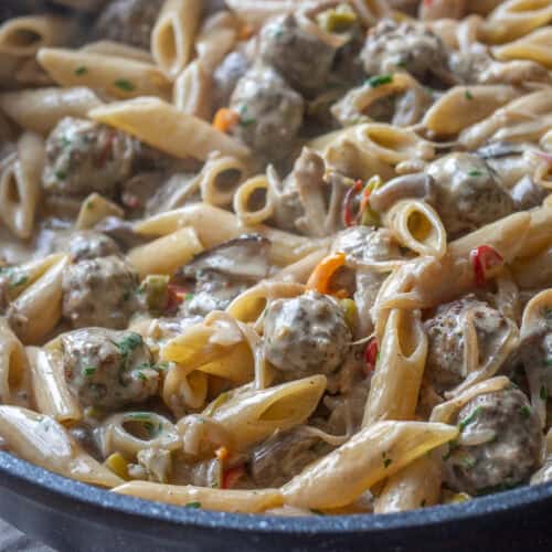boiled pasta is added to creamy meatball sauce