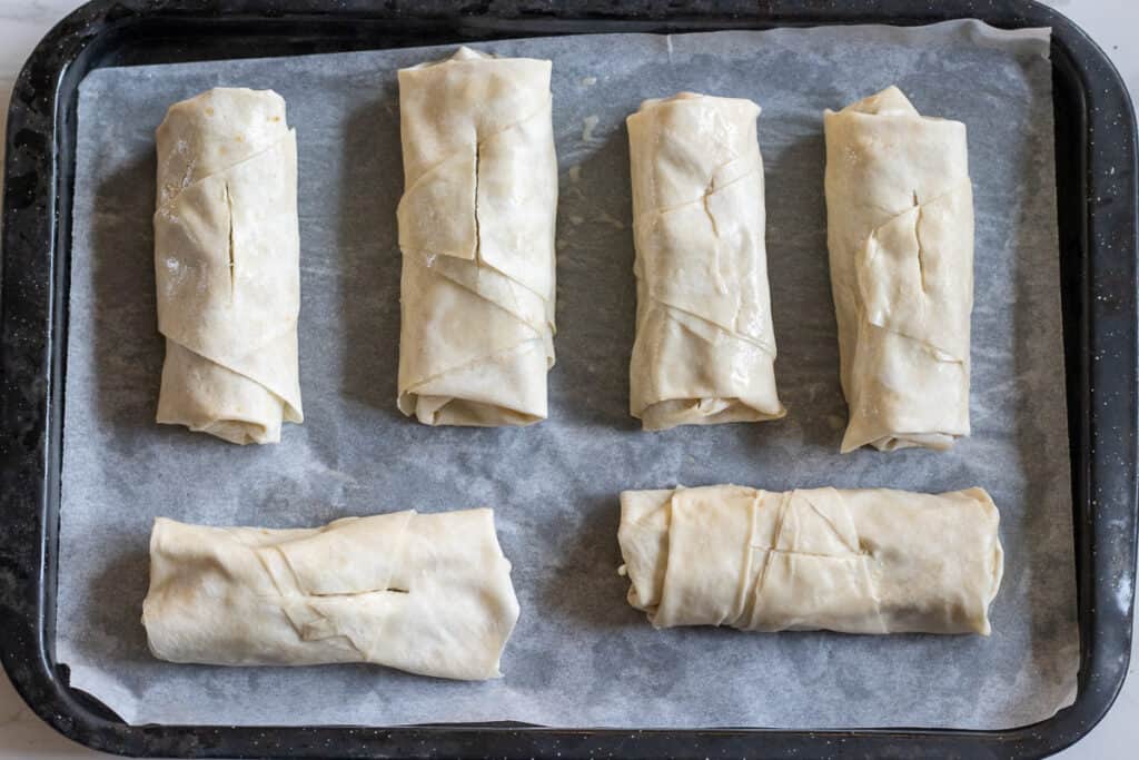 6 pieces of borek are placed on baking sheet.