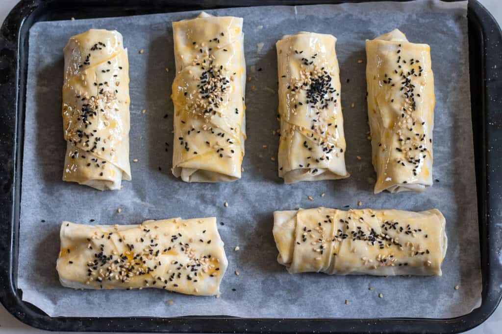 Filo parcels are brushed with egg yolk.