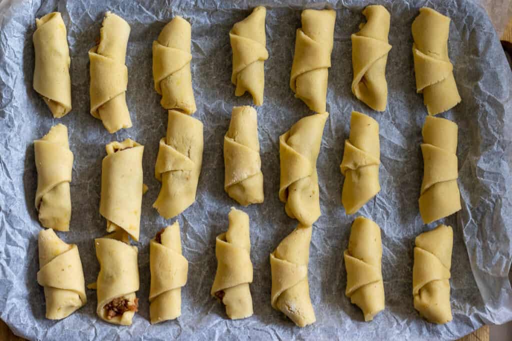 The cookies are placed on a tray lined with a baking sheet.