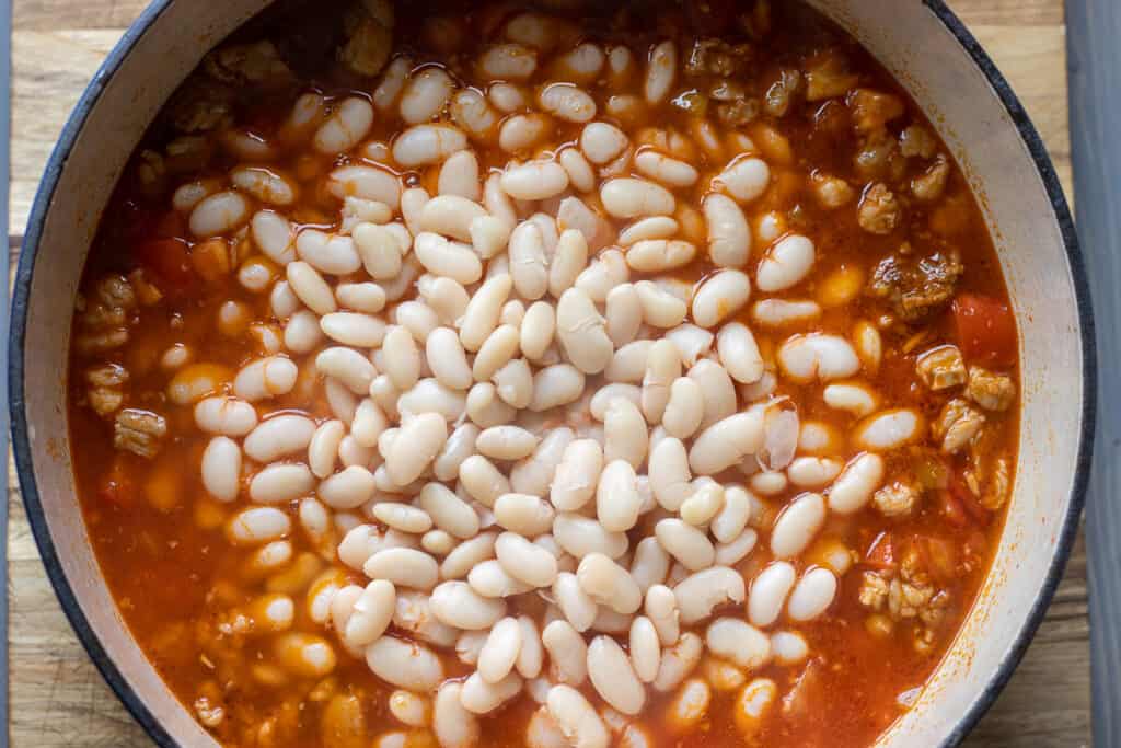 Pre-cooked white beans added to the pan with the meat and sauce.