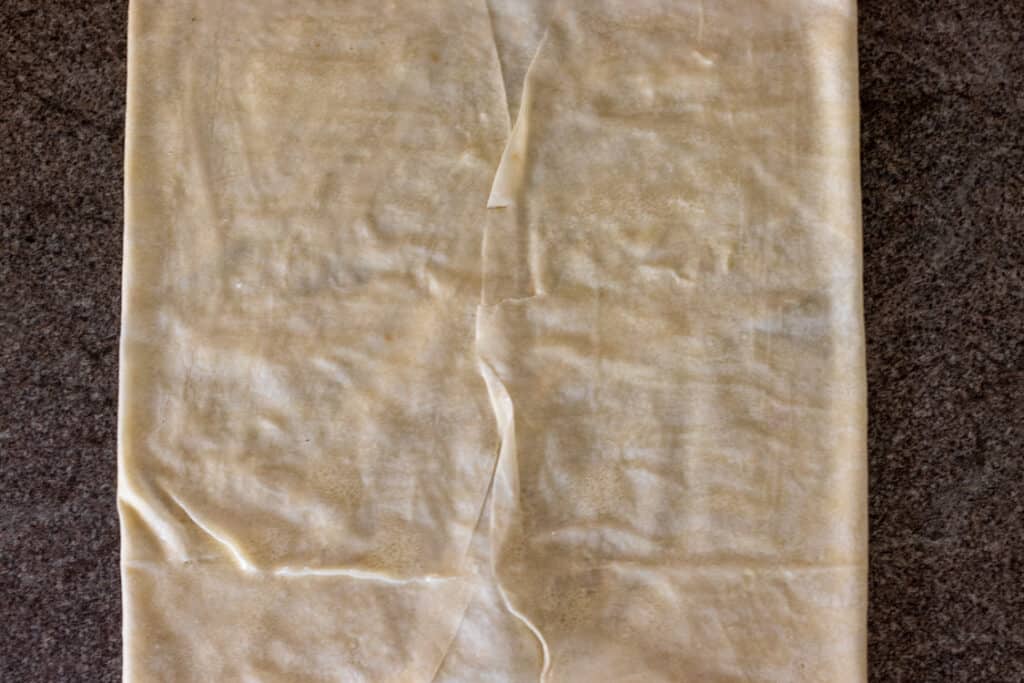 The remaining sides of the yufka folded in to form a square.