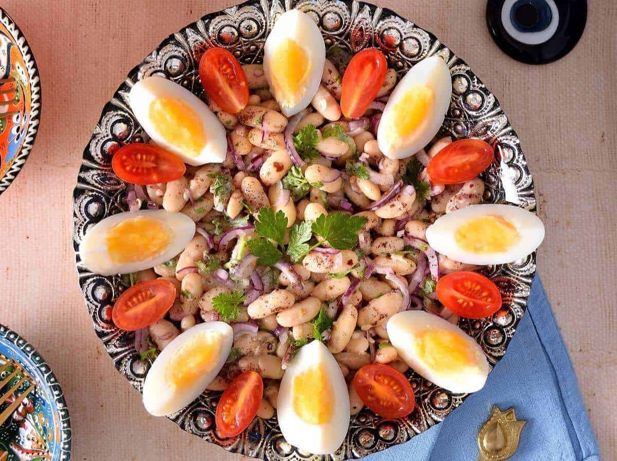 White bean salad served in a bowl.