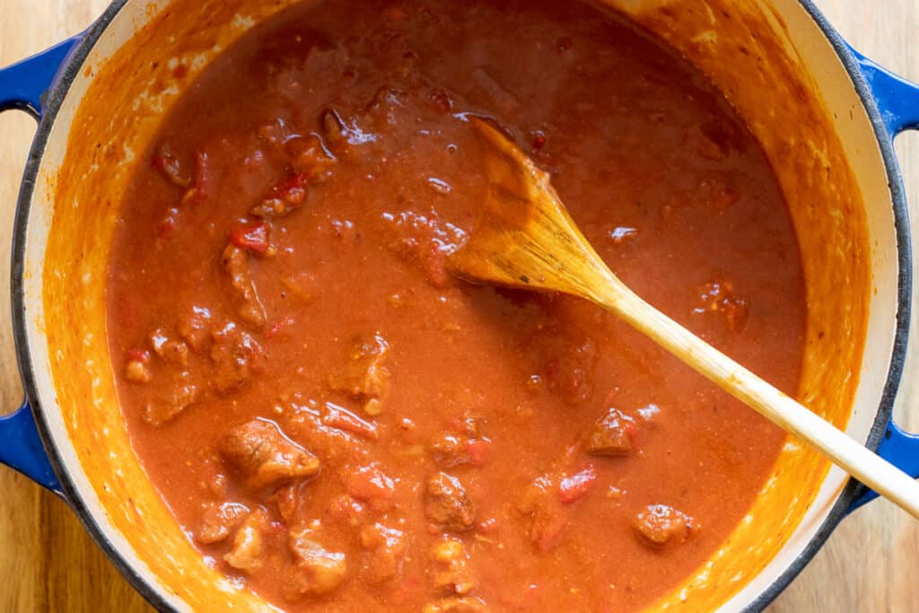 The meat cooked in the sauce until soft.