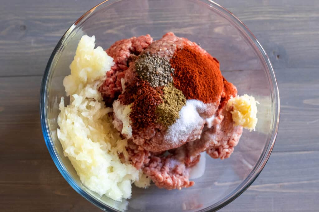 Ingredients for kofte are placed in a bowl.