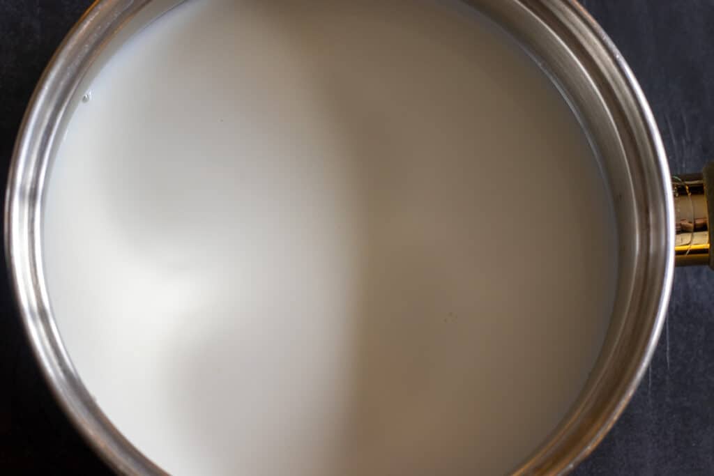 combine the sugar with milk and water