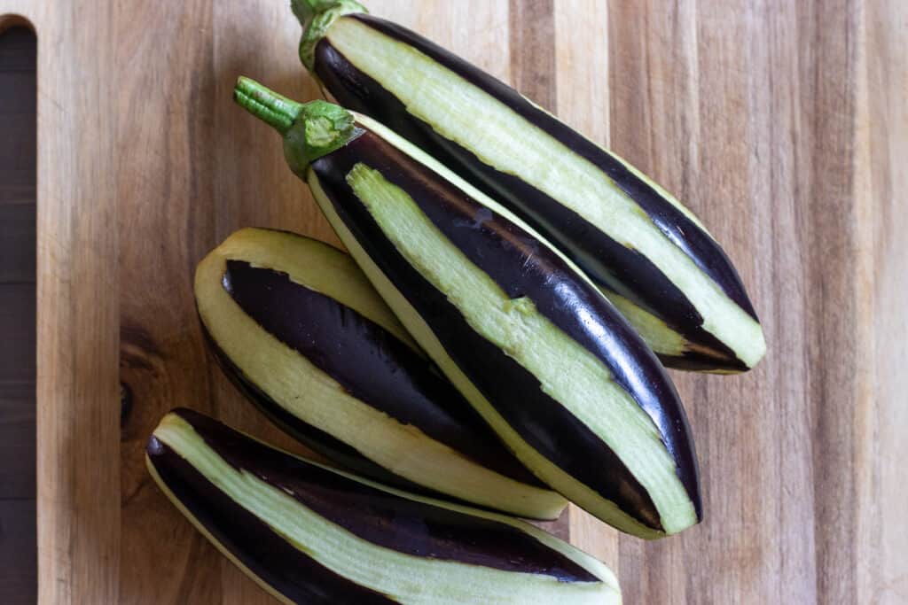 The eggplants are peeled in a zebra pattern.
