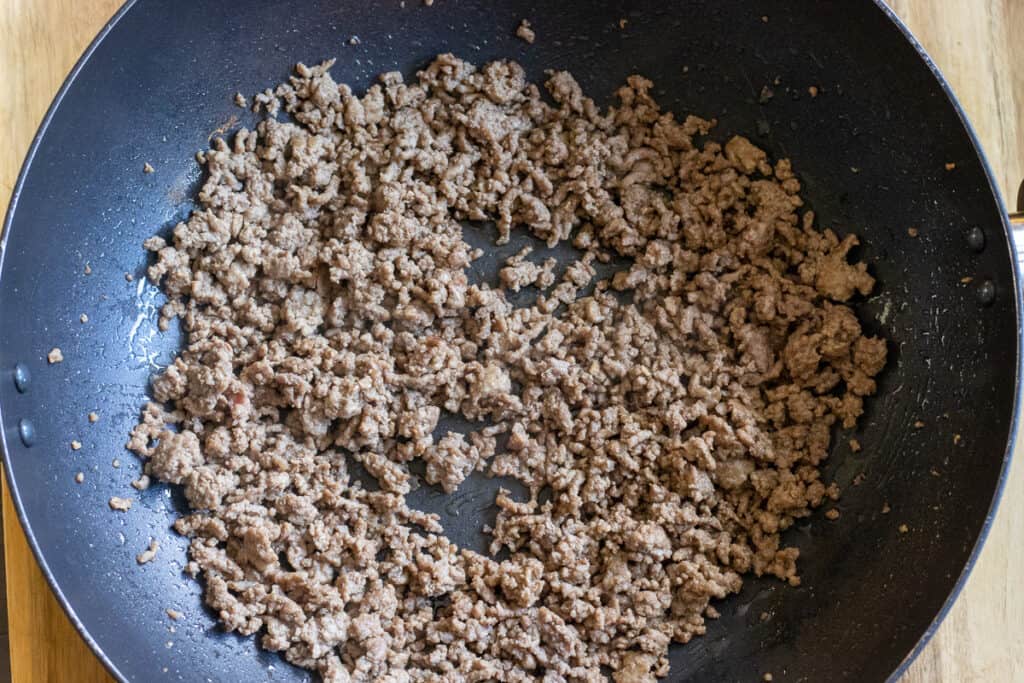 Sauteing ground beef in a pan.