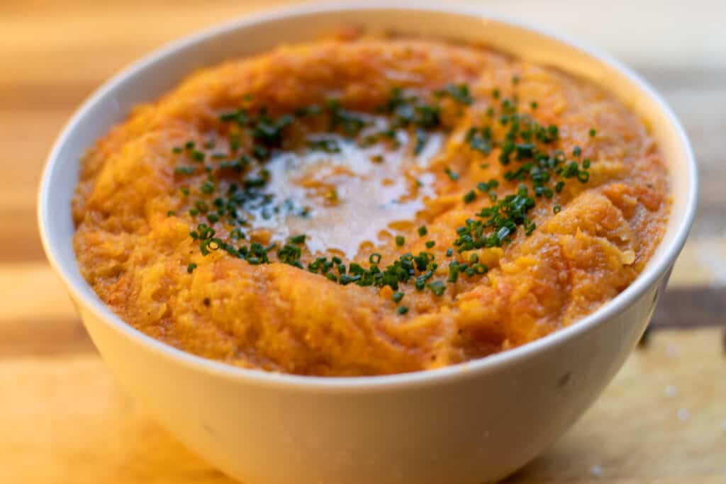 swede and carrot mash garnished with butter and chives