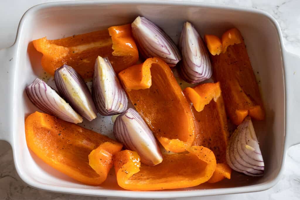 roast the onions and peppers in an oven dish