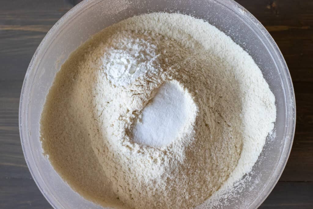 The dry ingredients are sifted in a separate bowl.