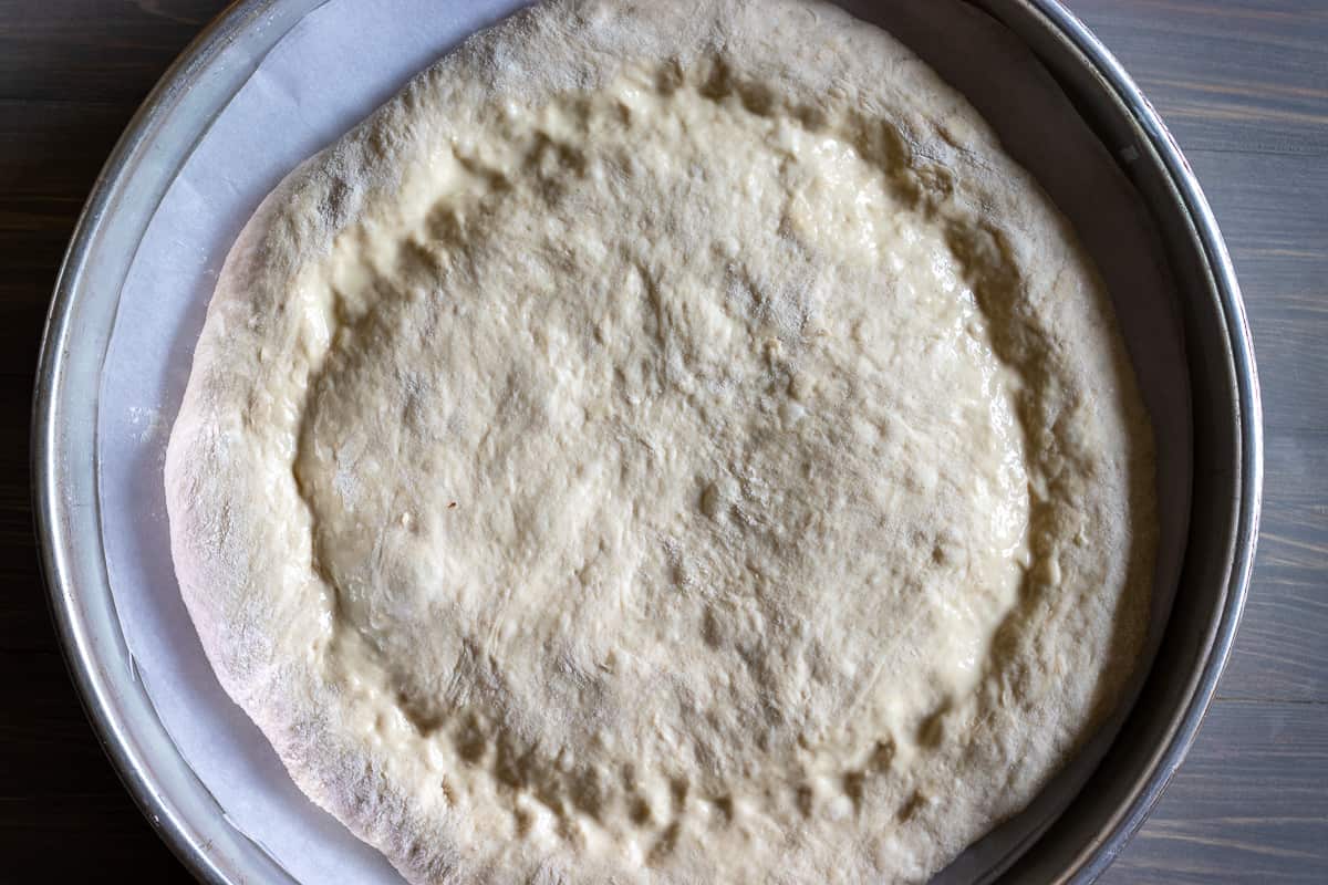 make indentations around the pide