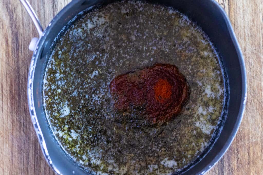 Butter melted with dried mint and paprika.