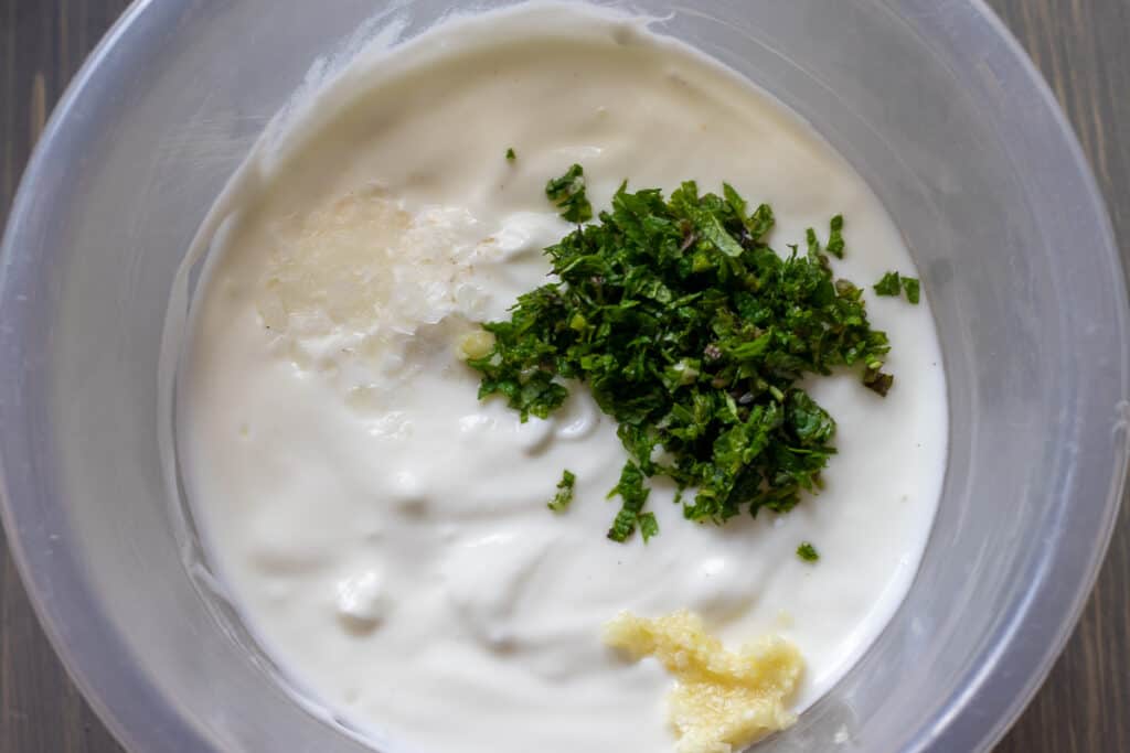 mix yoghurt with garlic and herbs