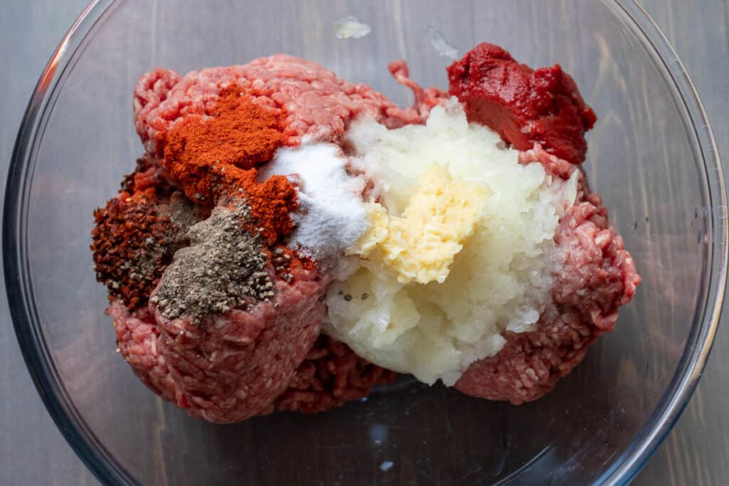 The meatball ingredients in a mixing bowl.