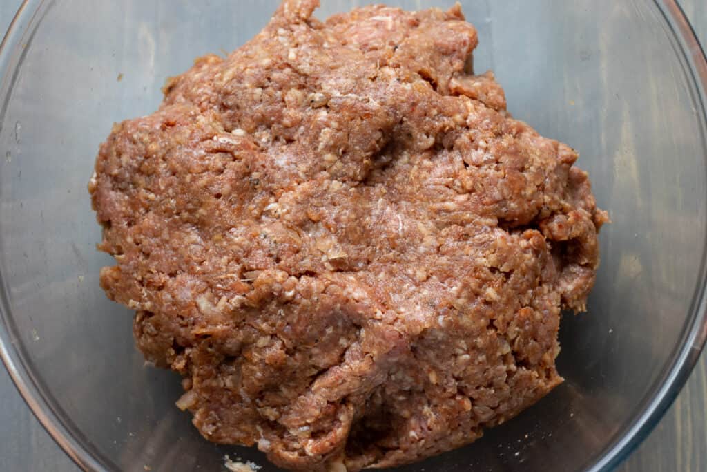 The meatball mixture kneaded until combined.