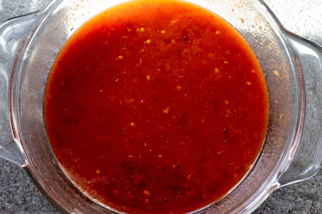 Water mixed into the tomato sauce.