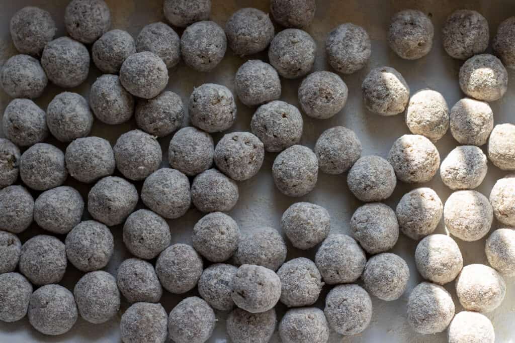 Meatballs are dusted with flour.