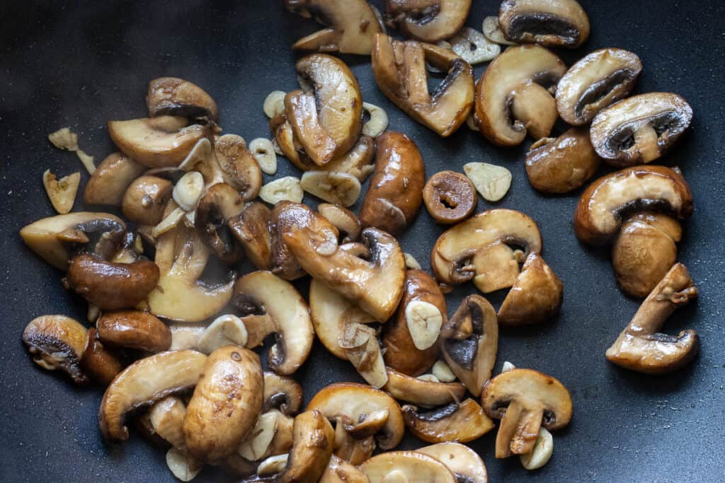 Sauté the mushrooms and garlic