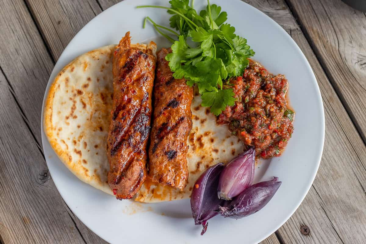 acini ezme served with adana kebab