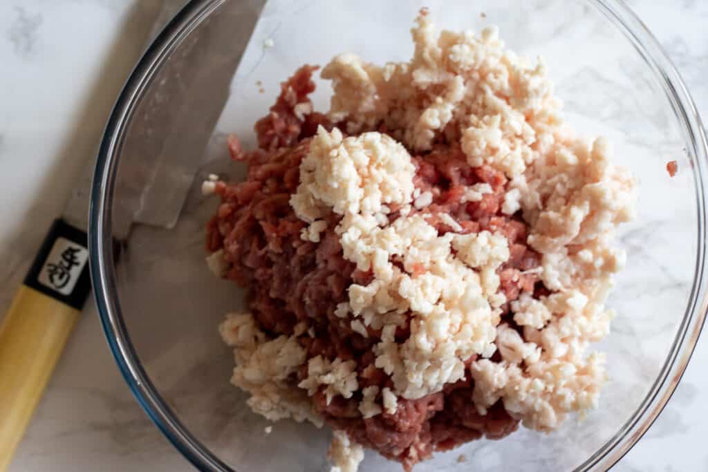 Chopped tail fat added to the lamb meat.