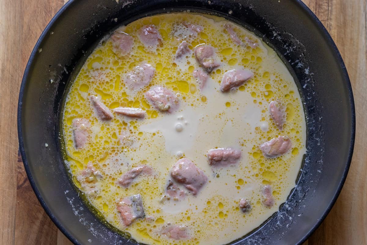 Cream is added to the pan.