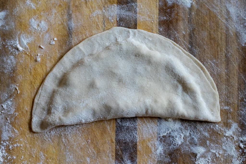 The edges are sealed with fingers.