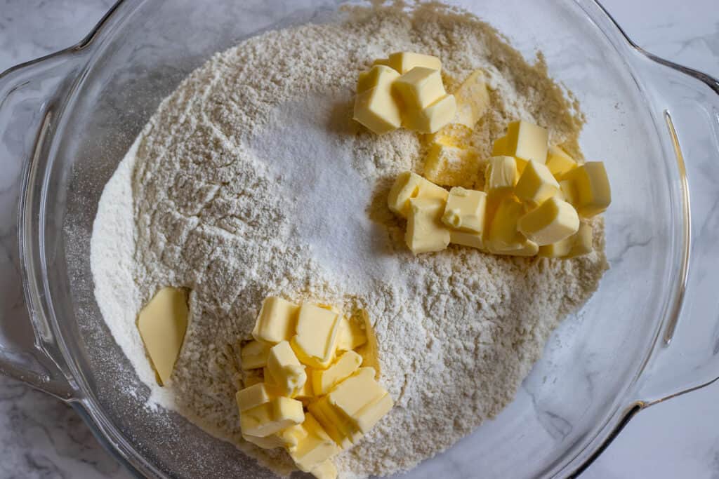The flour and cubed butter are in a bowl.