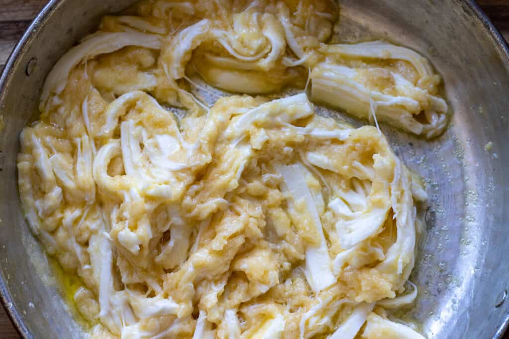 Grated Turkish cheese added to cooked cornmeal.