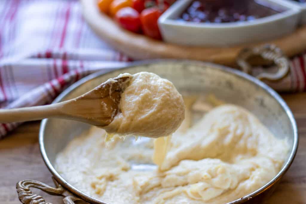 Hot kuymak with melted cheese and golden butter on top, ready to serve.