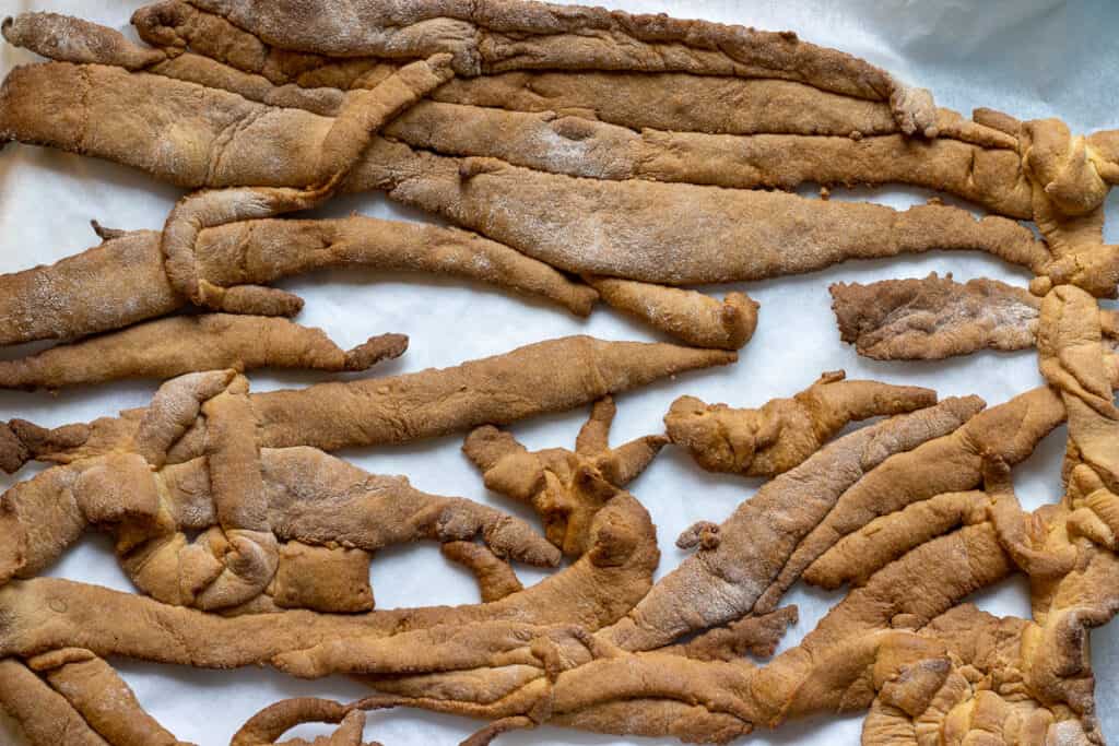 Dough scraps are baked in the oven until golden.