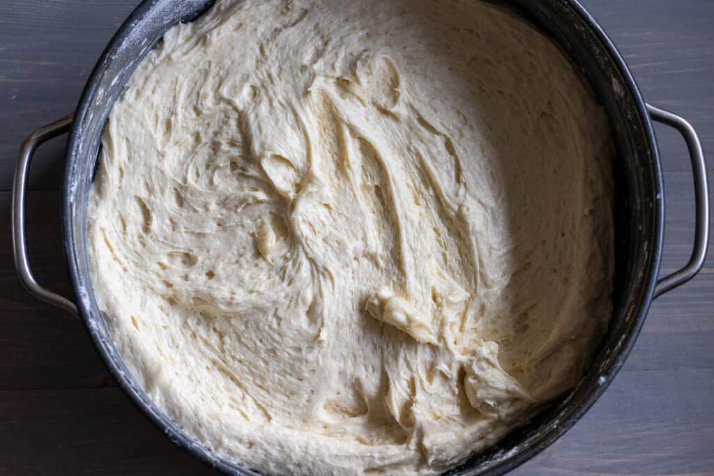 Cake batter is poured into the cake tin.